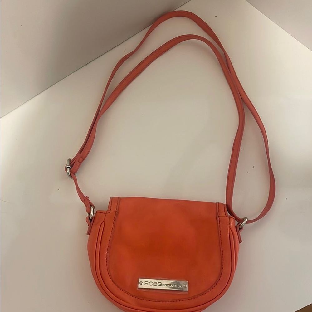 BCBG Orange Crossbody Bag with Adjustable Strap and Minimalist Design